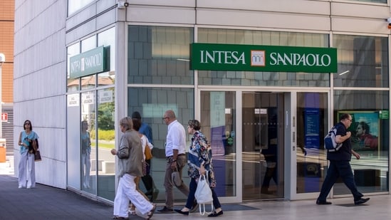 An Intesa Sanpaolo SpA bank branch in Brescia, Italy, on Tuesday. Italian stocks tumbled after a surprise new tax on bank profits sent the country's lenders tumbling, erasing as much as $10.4 billion from their combined market capitalization. (Bloomberg)